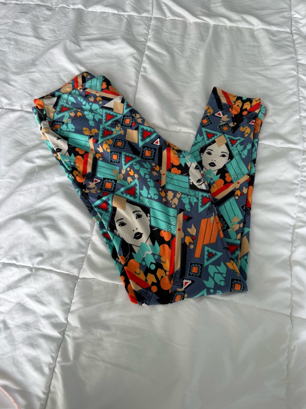 LuLaRoe Leggings in Teal, Orange, Black & Cream Geometric Face Print